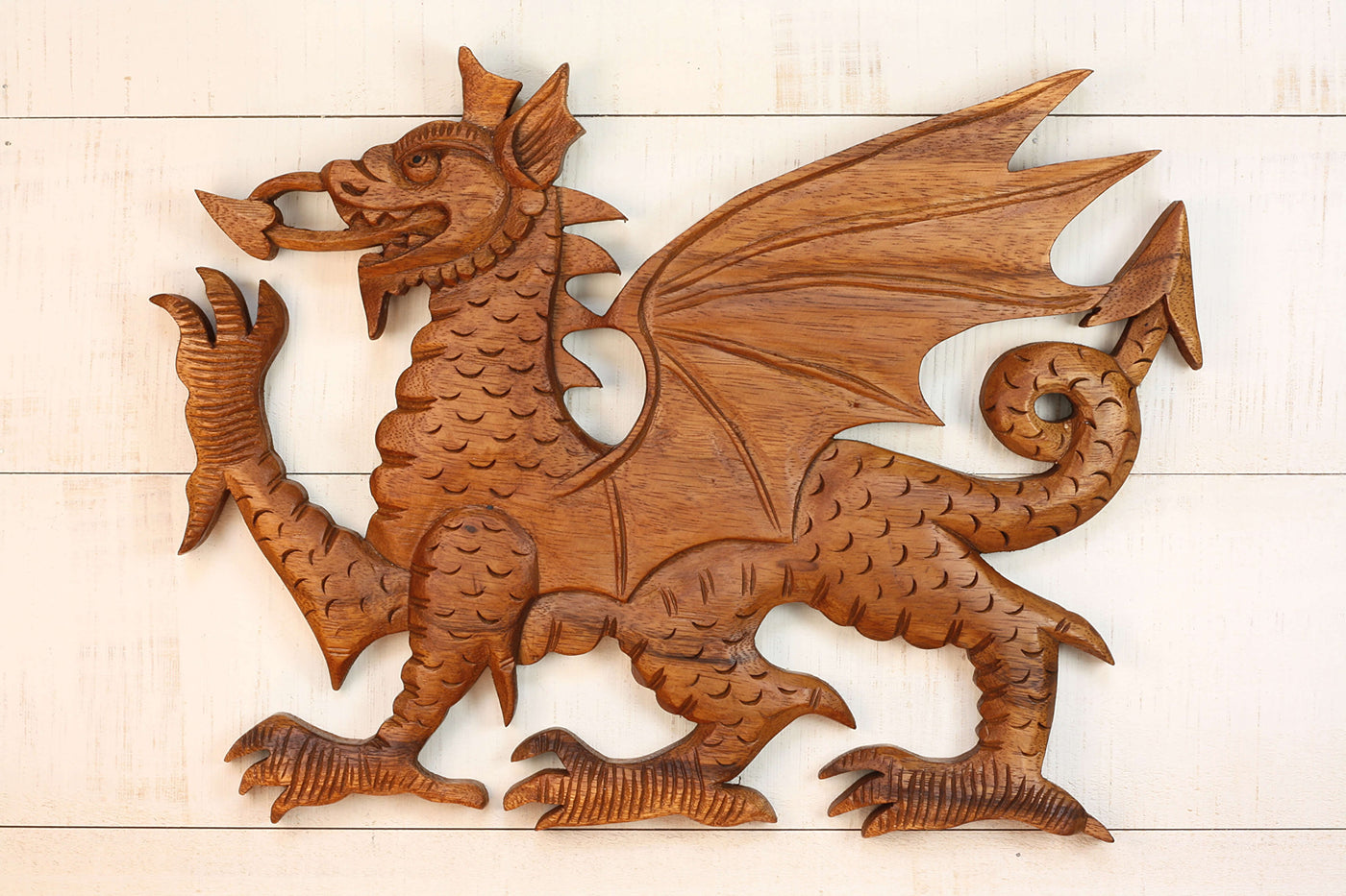 Hand carved wood dragon wall art with detailed wings and scales.