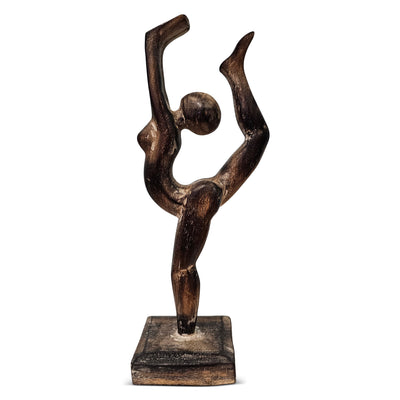 Black sculpture of a dancer on a white background