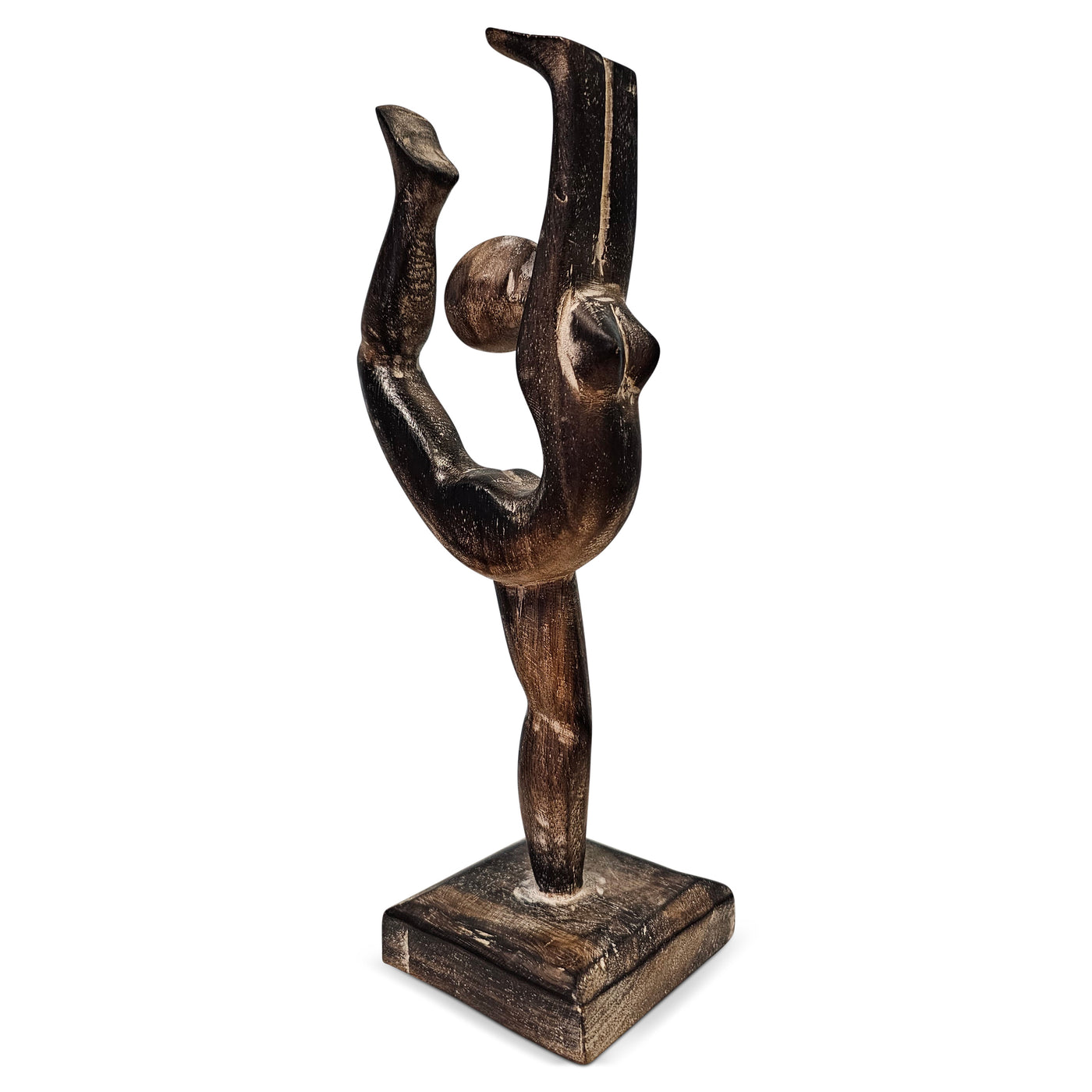 Wooden sculpture of a dancer on a white background
