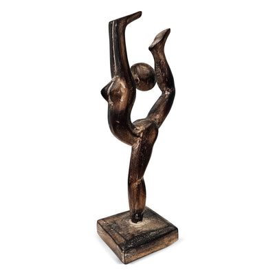 Black sculpture of a dancer on a white background