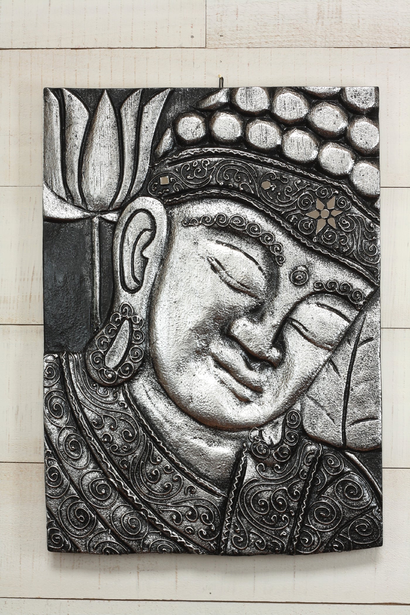 Hand carved silver Buddha wall panel with floral and swirl detailing