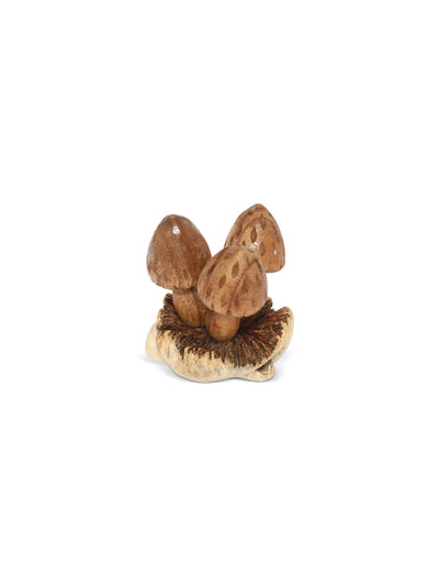 Wooden mushroom figurine on a white background