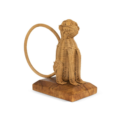 Hand woven rattan monkey figurine with curled tail on wood base