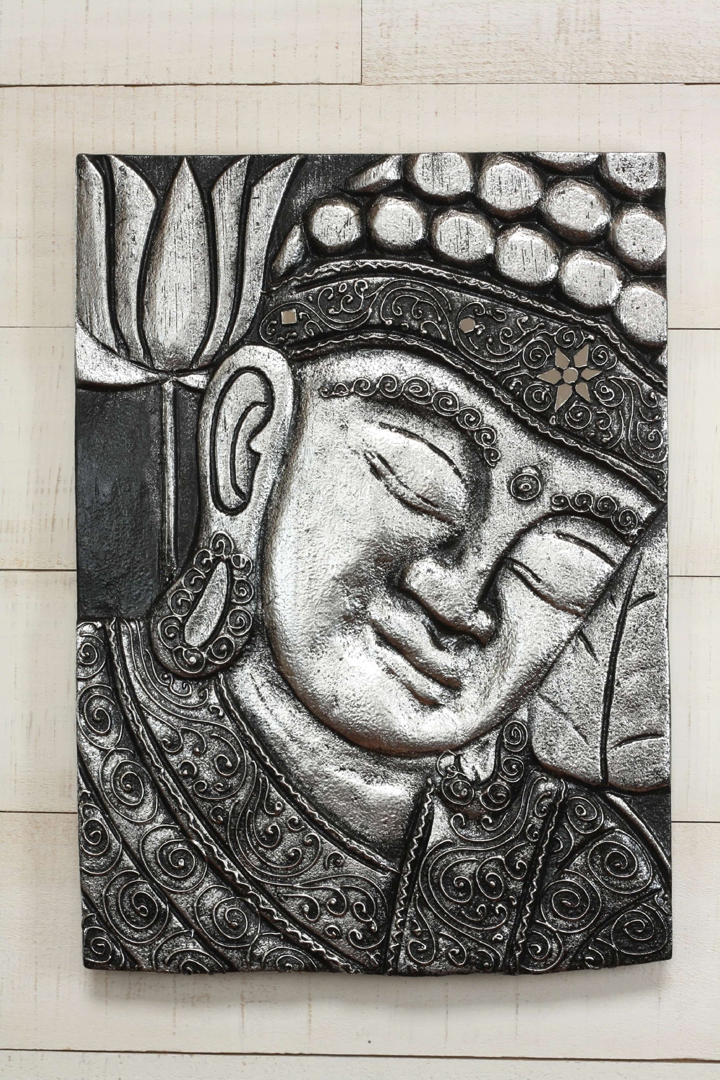 Hand carved silver Buddha wall panel with floral and swirl detailing