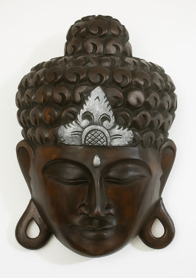 Bring tranquility to your home with this 12" hand carved wooden Buddha wall mask, black with silver crown. Perfect as spiritual décor, gift, or wall hanging.