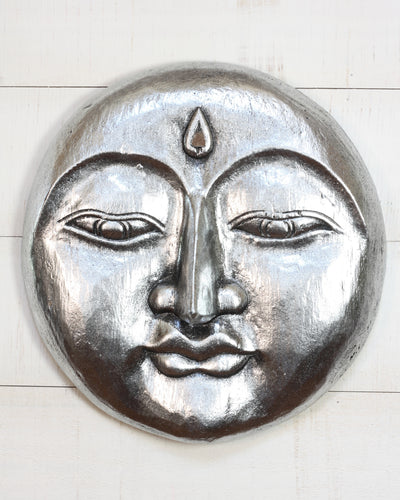 Hand carved silver wooden moon face wall sculpture with peaceful expression