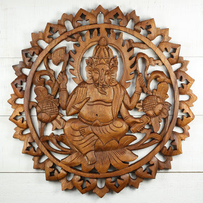 Hand carved wooden wall panel of Ganesha sitting on lotus with intricate mandala frame